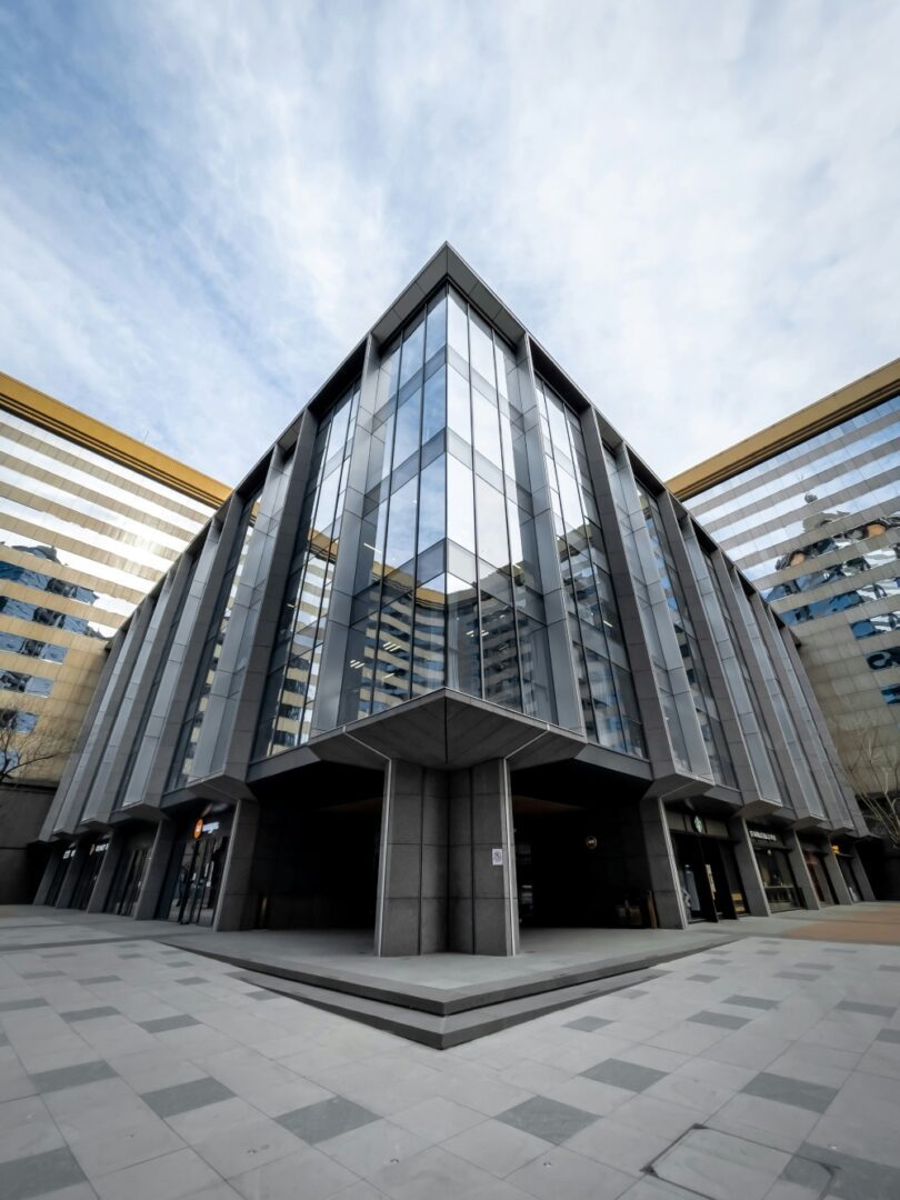 A large building with many windows and glass.